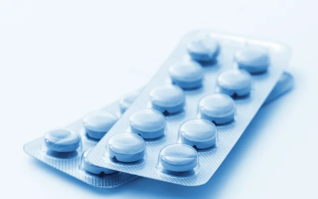 Nærfoto af piller i tabletform i pakning.